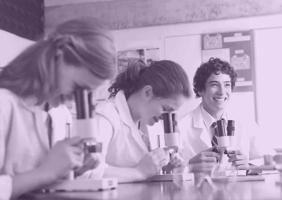 Children looking down microscopes